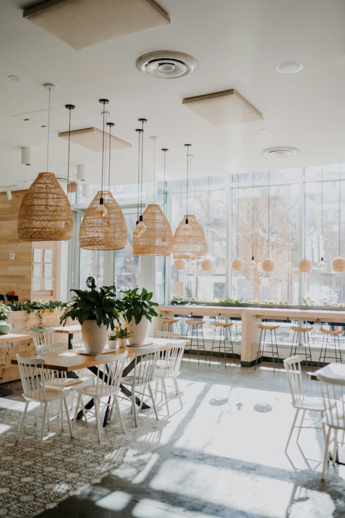 Bright modern café interior with pendant lighting